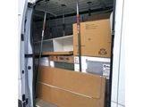 the back of a van with a bunch of boxes inside of it