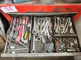 a drawer full of tools that are sitting on the floor