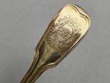 an image of a spoon with a gold handle