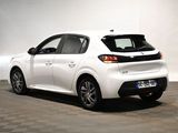 the rear end of a white car parked in a room