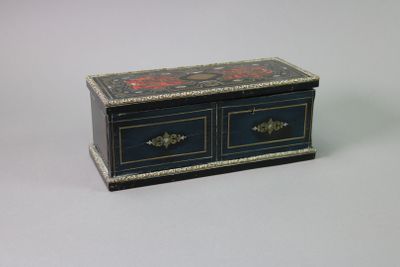 a small blue box with two drawers on top of it