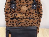 a brown and black leopard print purse with a black leather handle