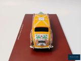 a toy car that is sitting on top of a book