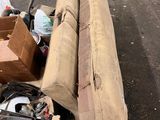 a pile of junk sitting on a pallet in a parking lot
