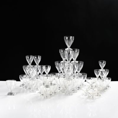 a lot of wine glasses sitting on a table