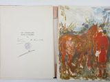 an open book with a picture of a horse on it