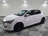 a white car is parked in a room with a checkered floor