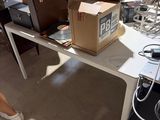 a table that has a bunch of boxes on top of it