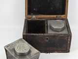 a small box that has a small metal object inside of it