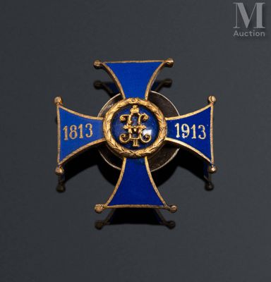 an image of a blue and gold cross with a crown on it