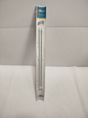 a close up of a toothbrush in a packaging on a white surface