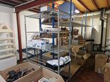 a room filled with lots of boxes and shelves