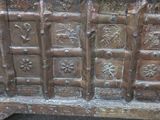 an old wooden chest with many decorative designs on it