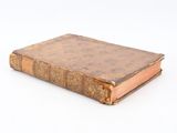 an old book that is sitting on a table