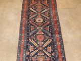 a long rug on the floor in a room