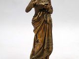 a bronze statue of a woman holding a baby in her arms