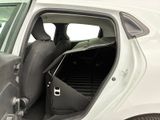 a white car with the door open and the passenger seat down
