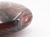 a glass object that is sitting on a white surface