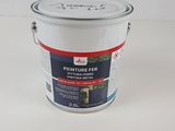 a close up of a paint can on a white surface