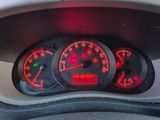 a close up of a car dashboard with a speedometer and gauges
