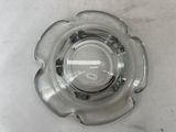 a glass bowl that has a small amount of water in it