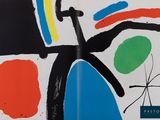 une image représentant un livre sur lequel figure la reproduction d'un tableau