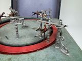 a lot of toy horses that are playing in a ring