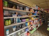 many shelves in the store that have various products on them