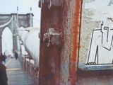 a sticker on the side of a building that has a drawing of a man on it