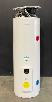 a white water heater sitting on top of a tiled floor next to a wall