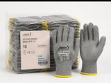 two pairs of gloves and a bag of gloves on the table