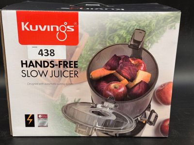 a box of kuvings hand - free slow juicer sitting on a table