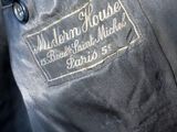 a close up of a black jacket with a white label on it