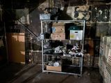 an image of a dirty room with a bunch of boxes