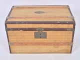 a small wooden box with a metal latch on it