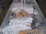 many pairs of shoes that are wrapped in plastic