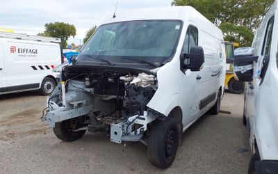 a white van that has a broken hood on the front of it