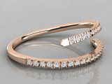 a close up of a diamond ring on a reflective surface