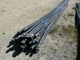 a bunch of steel pipes laying on the ground