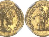a gold coin with an image of a woman holding a child