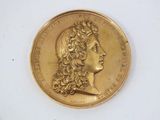 an image of a gold coin with a woman ' s face on it