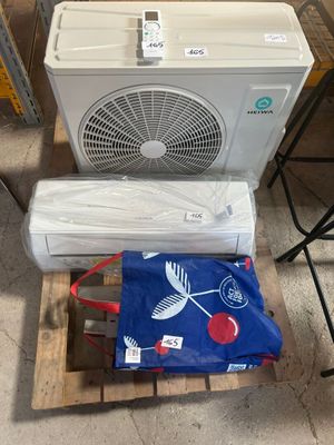 two air conditioners sitting on a pallet next to each other