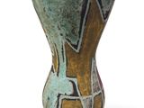 a vase with a design on it on a white surface