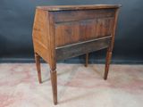 an old wooden desk with a drawer on top of it