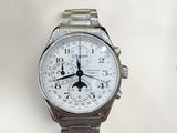 a close up of a wrist watch with a white dial