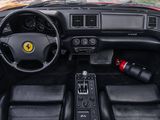 a dashboard of a sports car with black leather seats