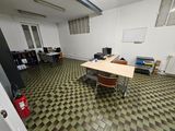 a room with a desk and a chair in it