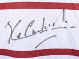 signed autograph of a tennis player holding a racquet on a tennis court