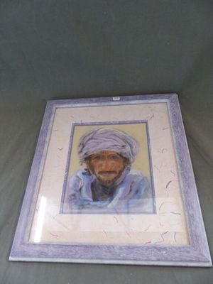 photo encadrée représentant un homme portant un turban sur la tête