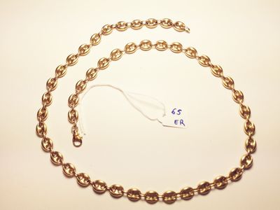 a close up of a gold chain with a price tag on it